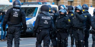 LEIPZIG, GERMANY - Nov 21, 2020: Fully armed German police officers protect a demonstration on Augustusplatz Leipzig policia alemania