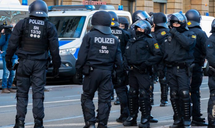 LEIPZIG, GERMANY - Nov 21, 2020: Fully armed German police officers protect a demonstration on Augustusplatz Leipzig policia alemania