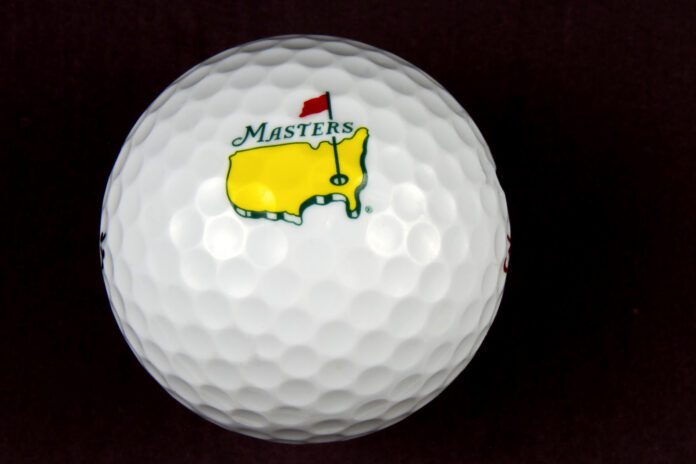 The Masters Tournament logo on a golf ball with black background