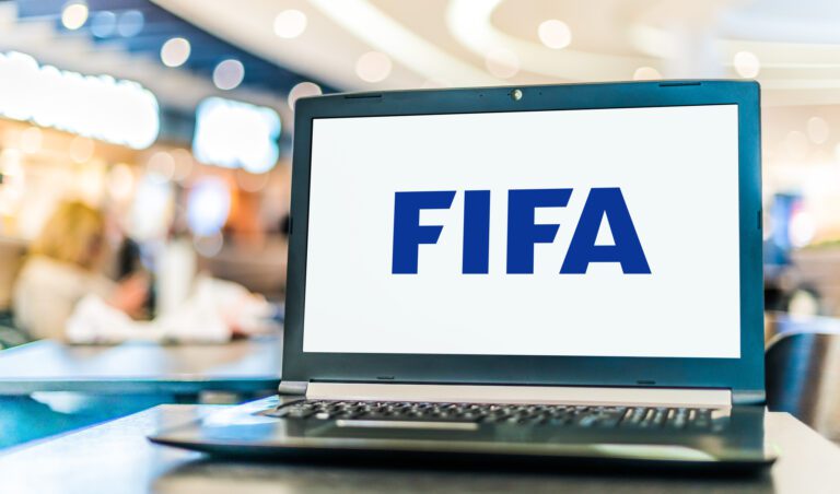 POZNAN, POL - NOV 22, 2022: Laptop computer displaying logo of FIFA, an international governing body of association football, beach football and futsal